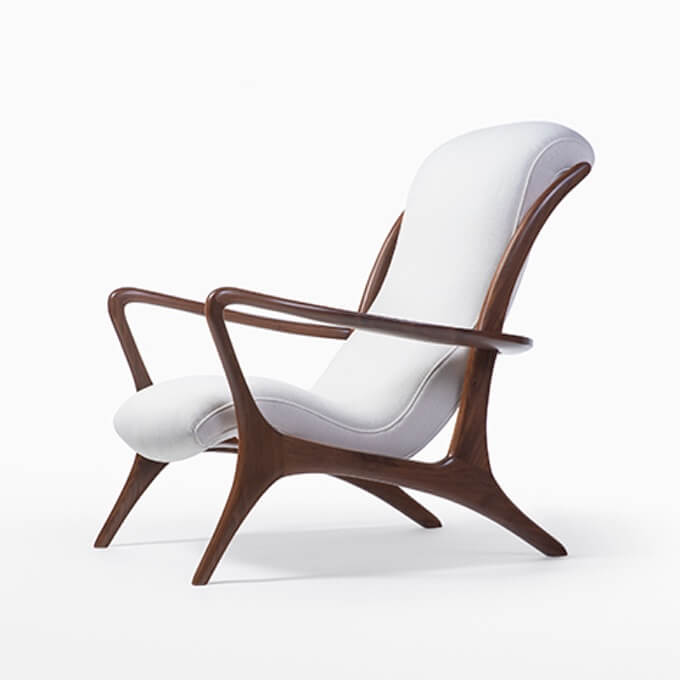 Studio B white padded lounge chair with brown stained wood frame